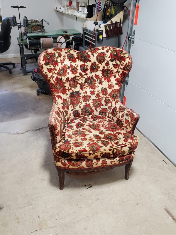 Antique chair with unique red and beige patterns