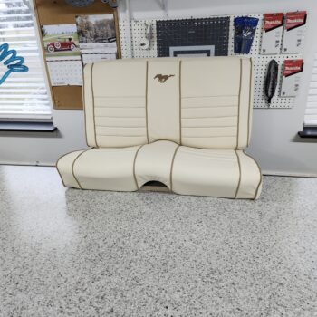 Reupholstery interior ford mustang 1966 with leather featuring cream leather bucket seats with brown piping and embroidered pony logos