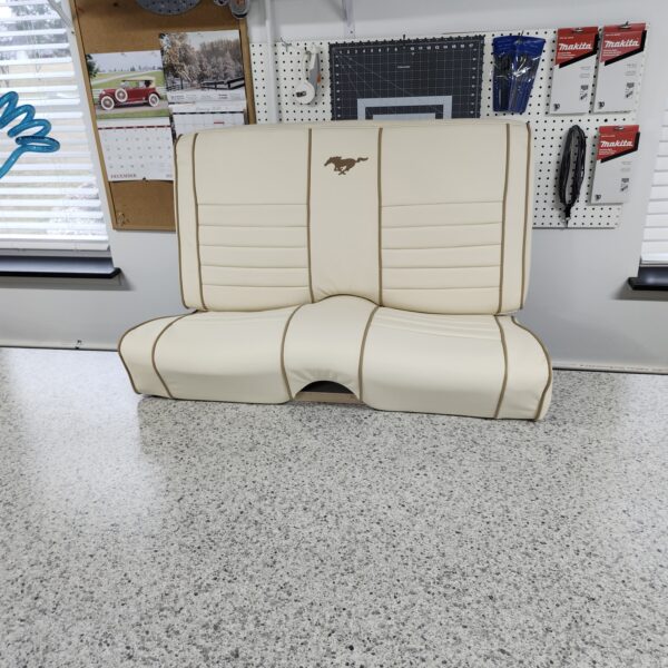 Reupholstery interior ford mustang 1966 with leather featuring cream leather bucket seats with brown piping and embroidered pony logos