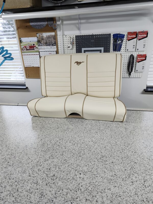 Reupholstery interior ford mustang 1966 with leather featuring cream leather bucket seats with brown piping and embroidered pony logos