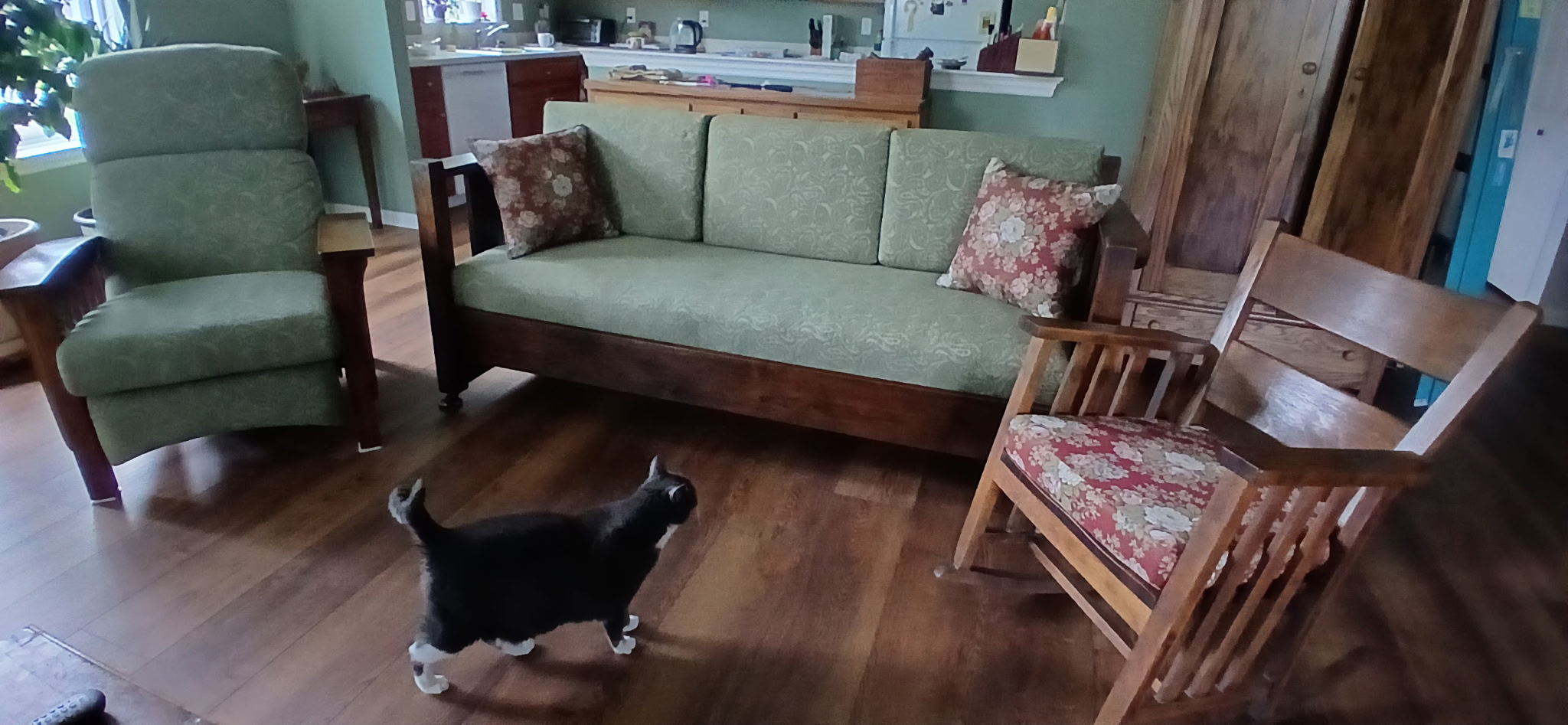 Antique Mission settee with new cushions in Frederick MD client home with matching armchair