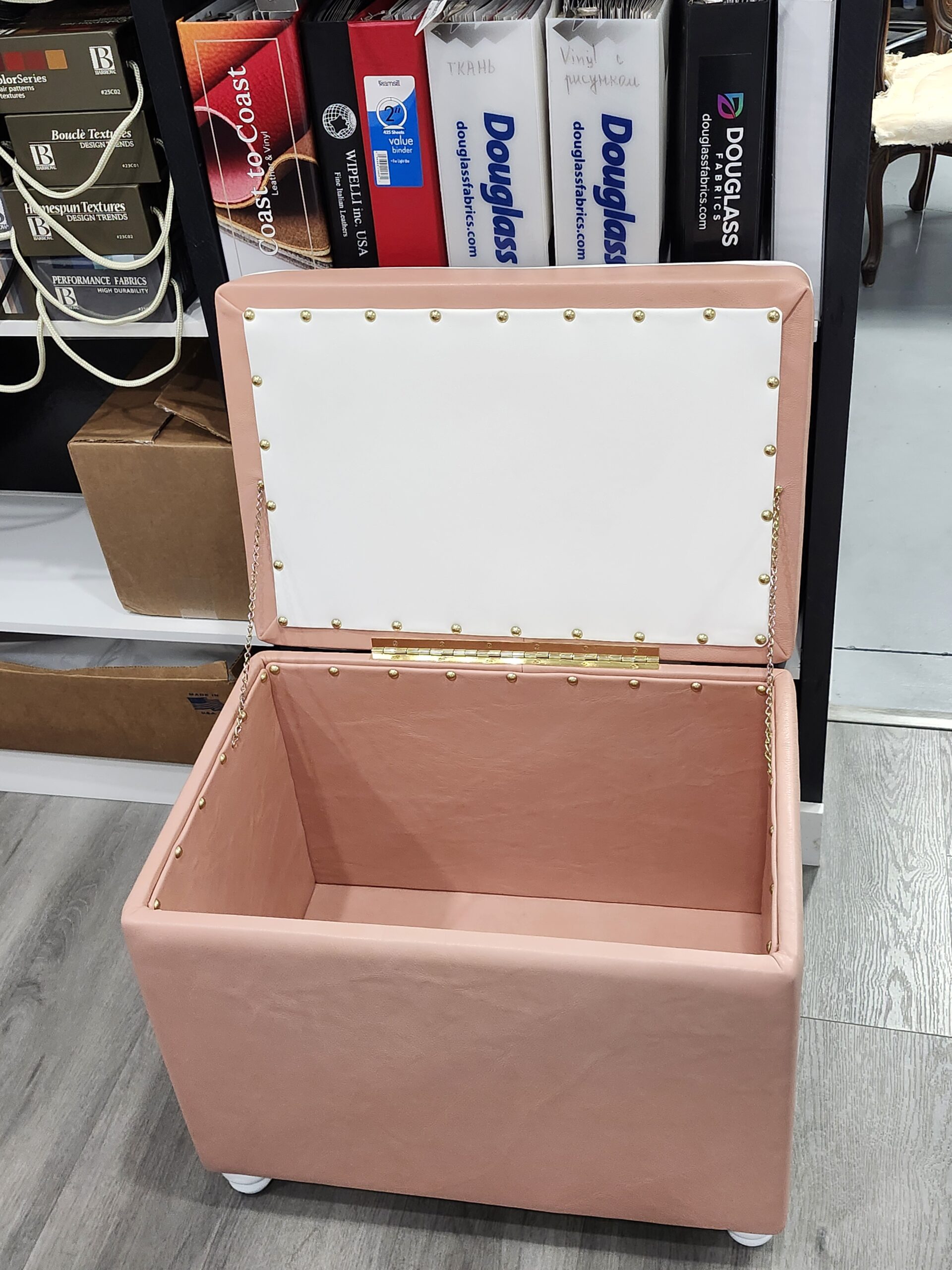 Custom storage ottoman reupholstered in pink leather with white welt trim by Alex Upholstery Shop serving Wilmington DE