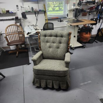 Recliner reupholstery Lebanon PA project: mid-century La-Z-Boy recliner finished in gray-green heathered tweed with a six button biscuit tufted back, padded arms, pleated skirt and turned wood posts, front view at Alex Upholstery Shop